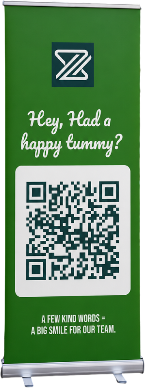 Roll-up banner stand with a QR code asking customers for a review